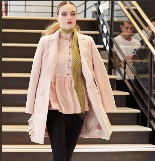 Model in Banana Republic x Olivia Palermo pink jacket and peplum top