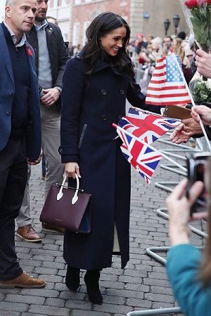 Meghan Markle Mackage coat and Strathberry bag